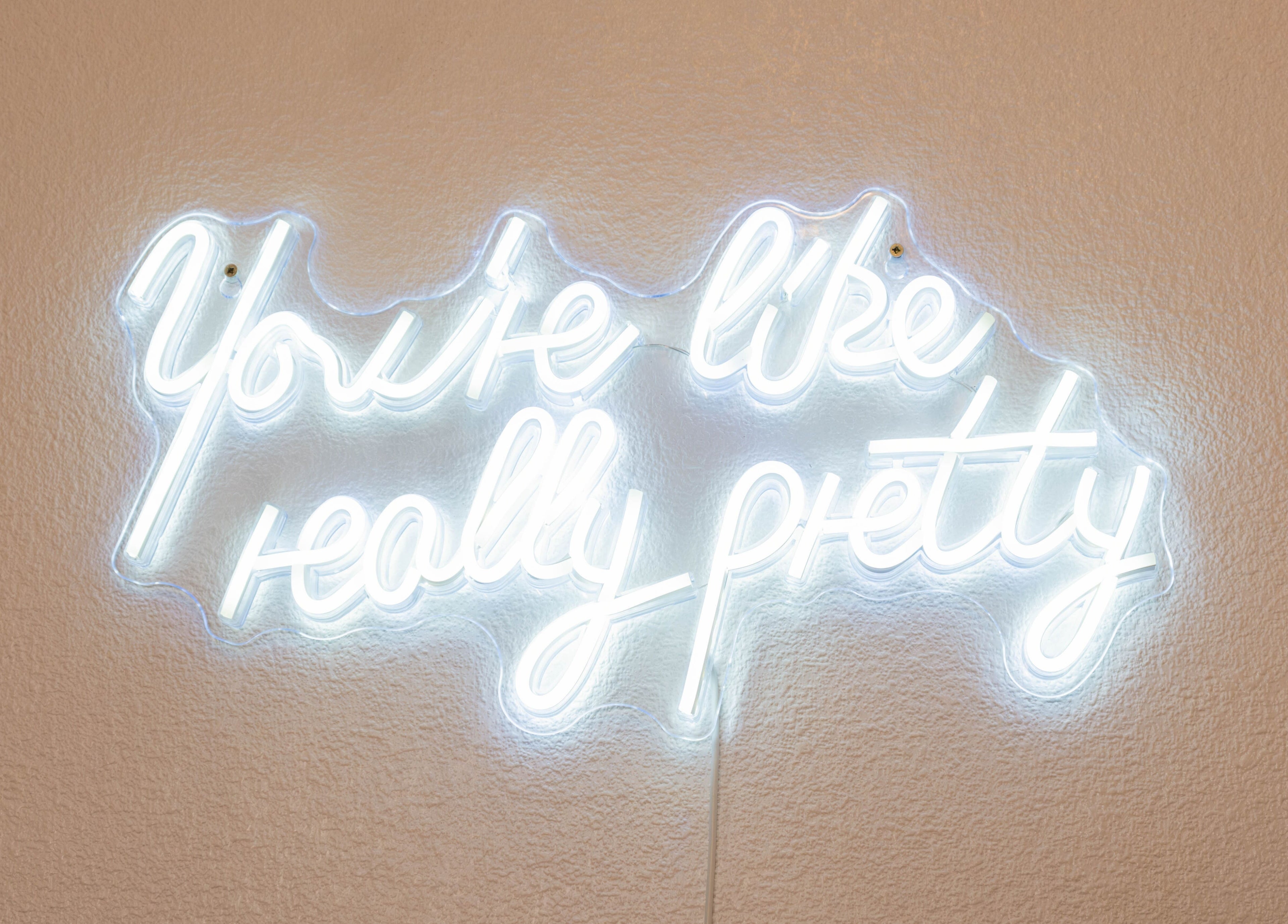 Neon sign reading 'You're like really pretty' at Arieyes, London, England, GB.