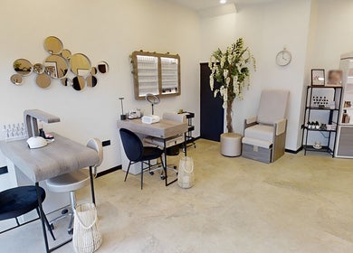 Chic interior of Calon Beauty in Cardiff, Wales, GB with modern decor and beauty products display.
