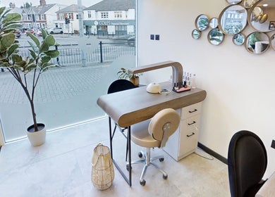 Modern nail station at Calon Beauty, Cardiff, Wales, GB, with stylish decor and natural lighting.