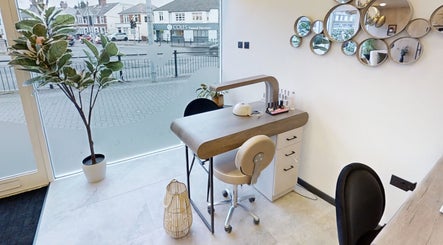 Modern nail station at Calon Beauty, Cardiff, Wales, GB, with stylish decor and natural lighting.
