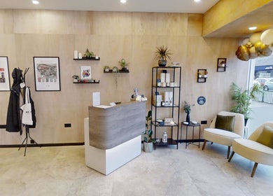 Calon Beauty reception area in Cardiff, Wales, GB with stylish decor and cozy seating.