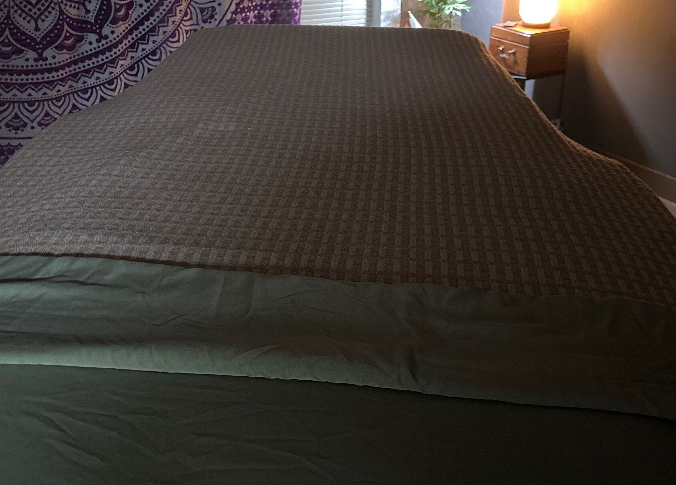 Cozy massage room at Coastal Relaxation, Tulsa, Oklahoma, US with soft lighting and warm decor.