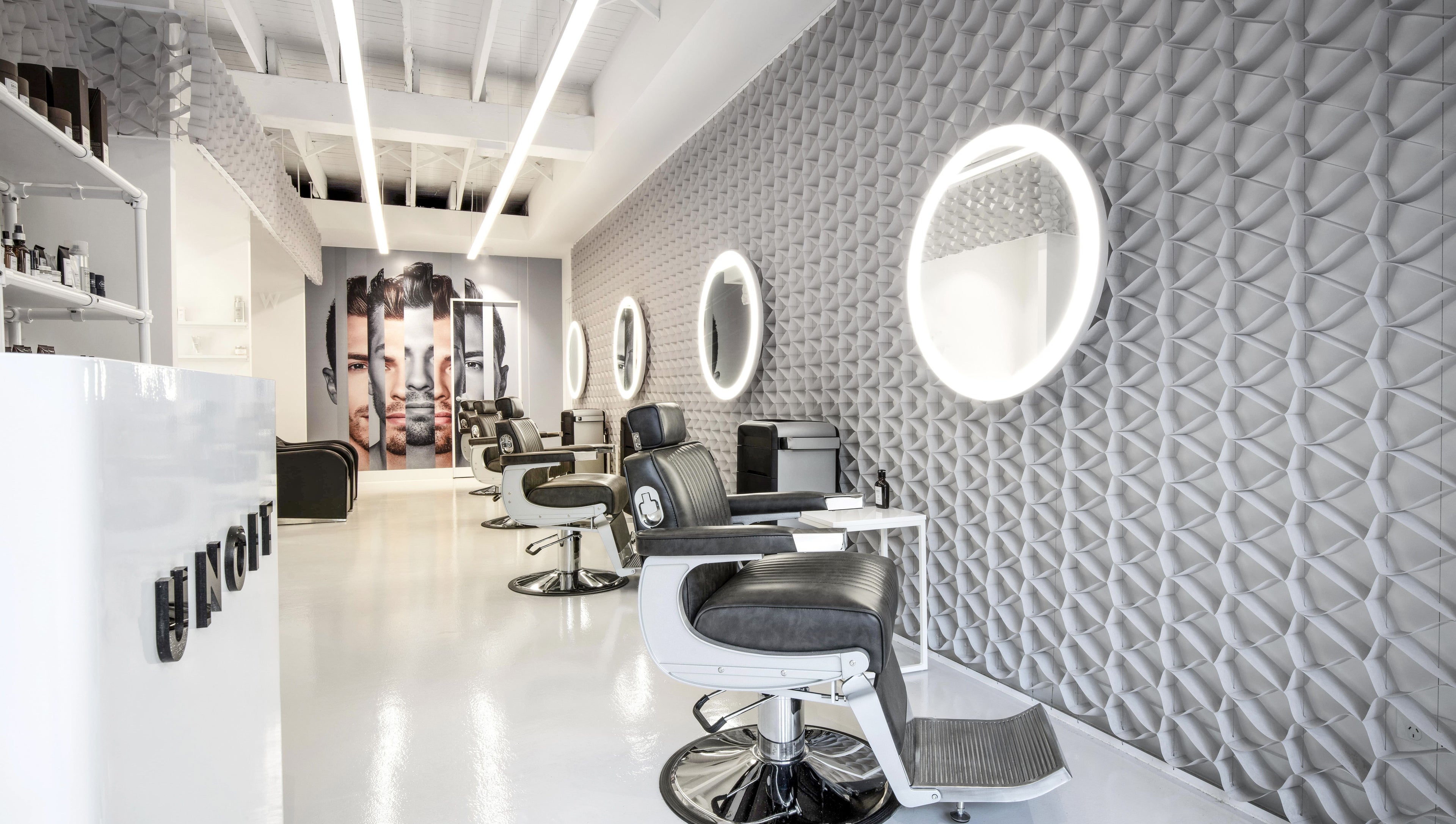 Modern interior of UNOIT Barber in Darlinghurst, New South Wales, AU featuring stylish barber chairs and mirrors.