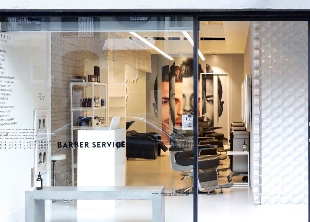 Interior view of UNOIT Barber in Darlinghurst, New South Wales, AU showcasing sleek, modern design.
