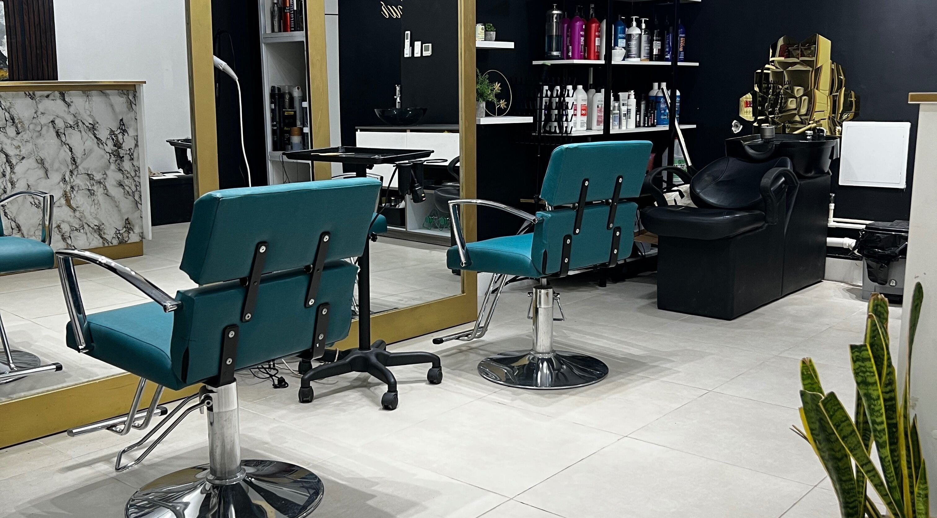 Modern salon interior at Endorse Your Beauty, Kingston, St. Andrew Parish, JM, with stylish chairs and mirrors.