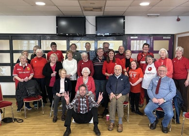 Community event at Vixi Wellbeing Hub in Darlington, England, GB with smiling group of seniors.