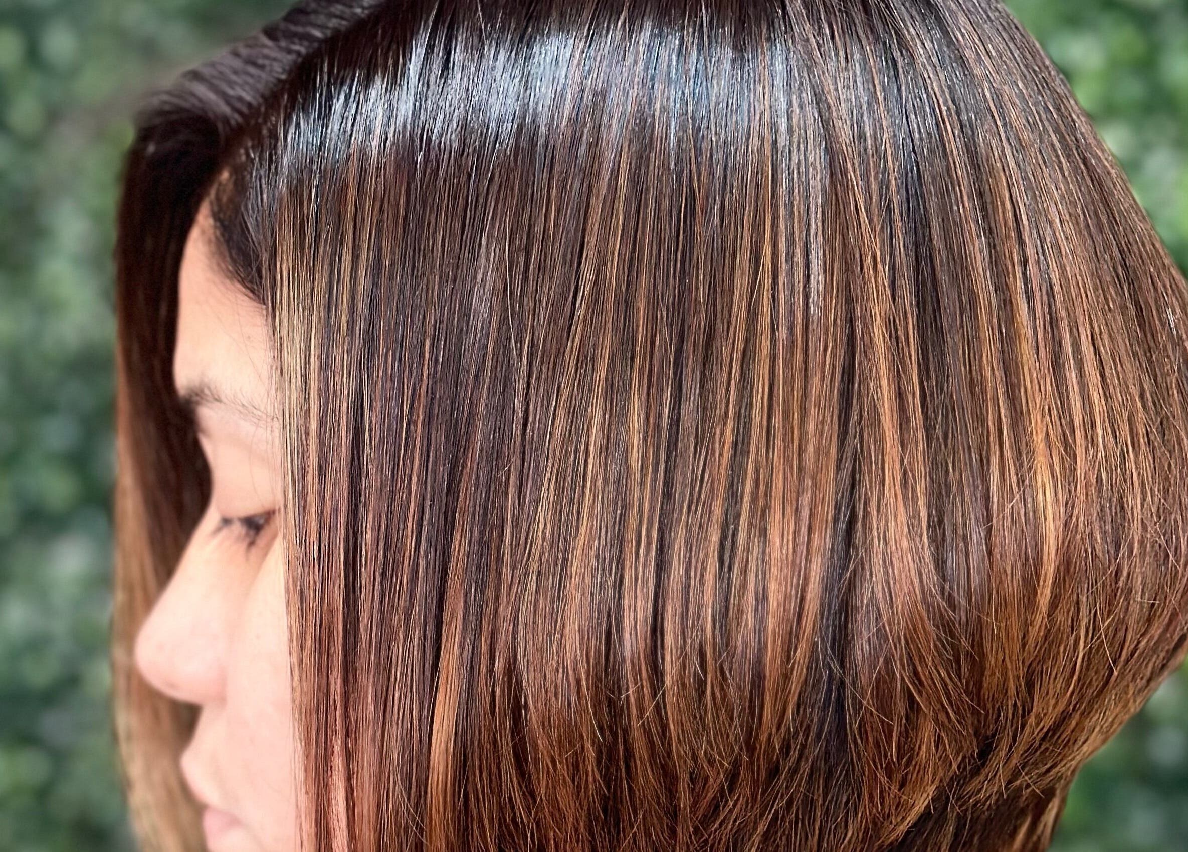 Chic bob haircut at Concept Dominican Hair Studio, West Palm Beach, Florida, US, showcasing shiny brown tones.