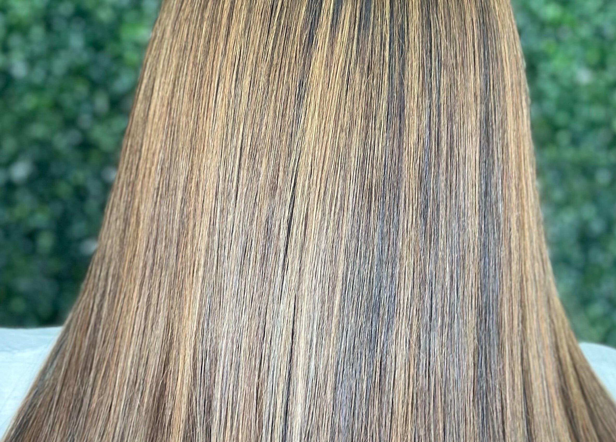 Smooth and sleek hairstyle at Concept Dominican Hair Studio in West Palm Beach, Florida, US.