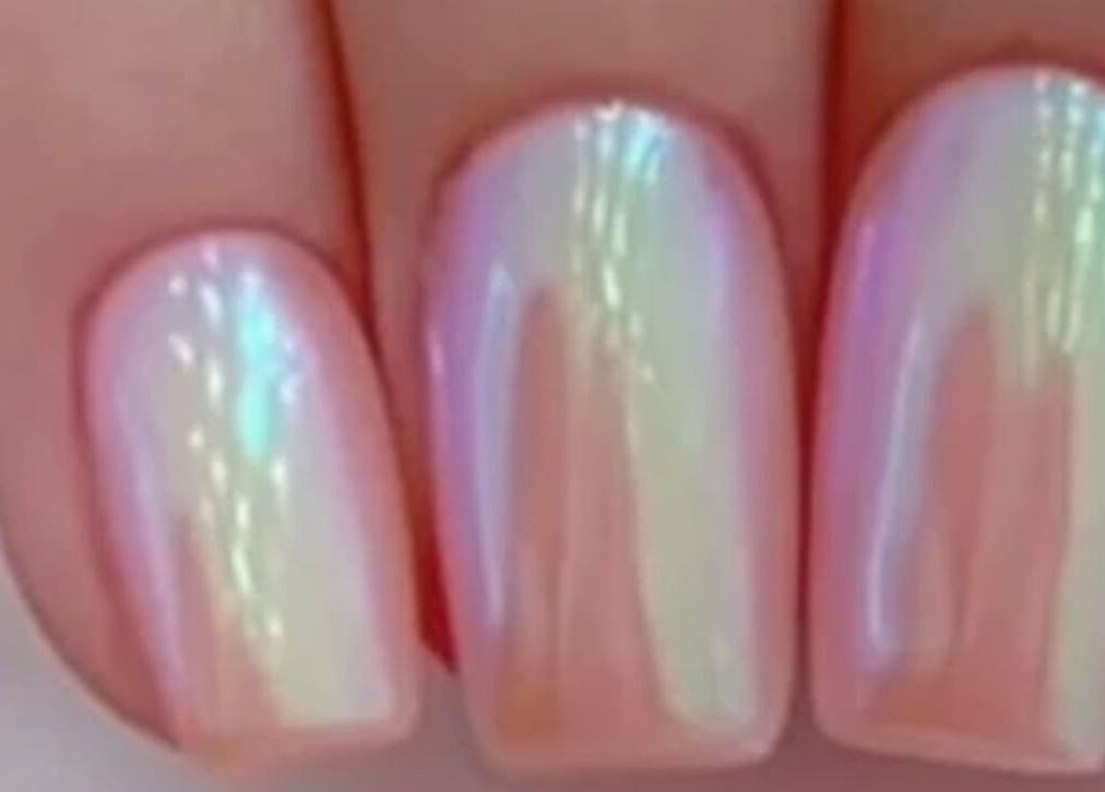 Close-up of iridescent nail art at Concept Dominican Hair Studio, West Palm Beach, Florida, US.