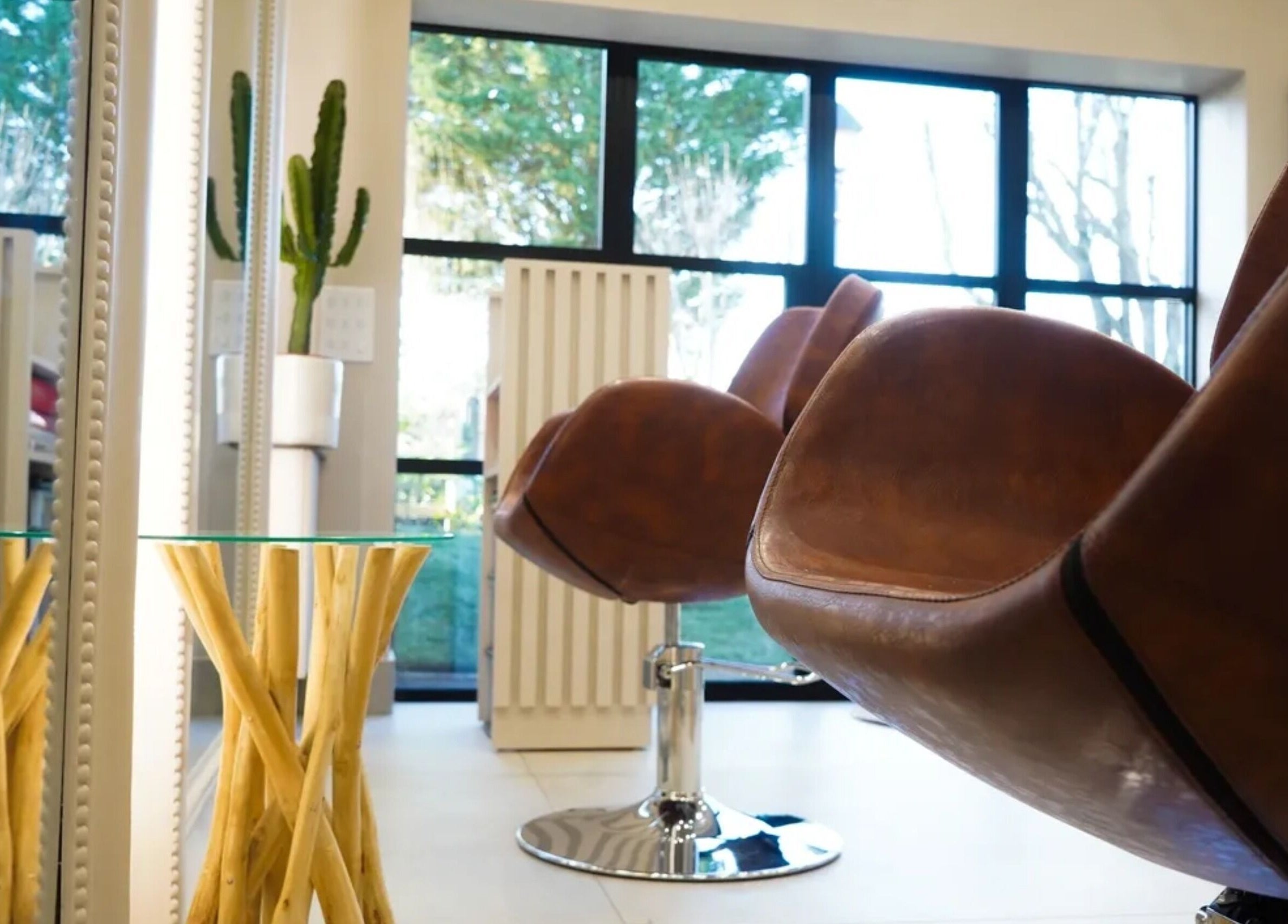 Modern salon chair in Grace Waker Hair, Oakley, England, GB, highlighting stylish interior design.