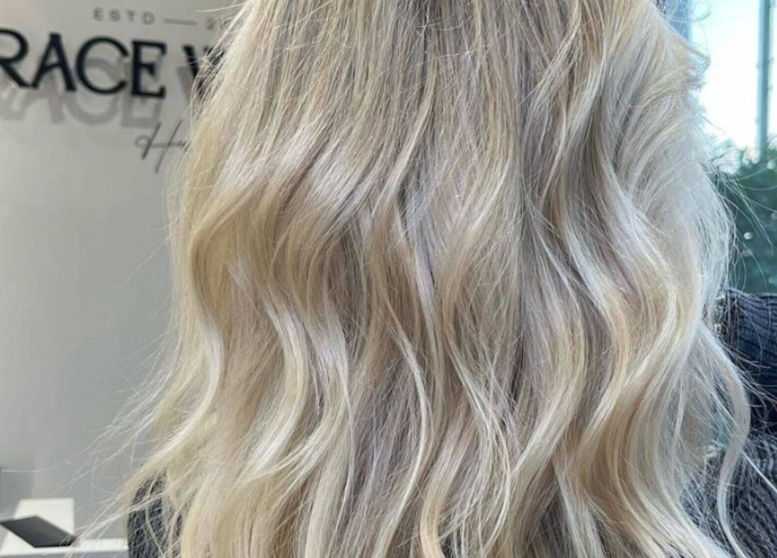 Elegant blonde waves styled at Grace Waker Hair, Oakley, England, GB, highlighting professional hairstyling services.