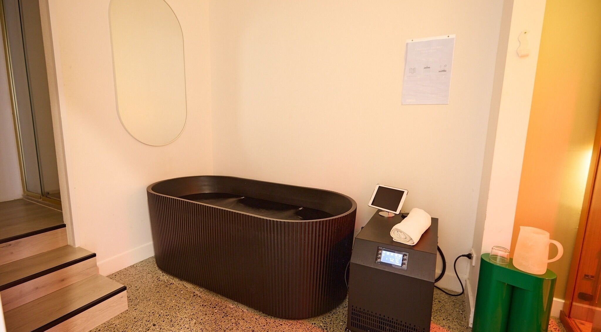 Relaxing black bathtub at Nimbus Co Manly in Manly, New South Wales, AU, showcasing elegant wellness design.