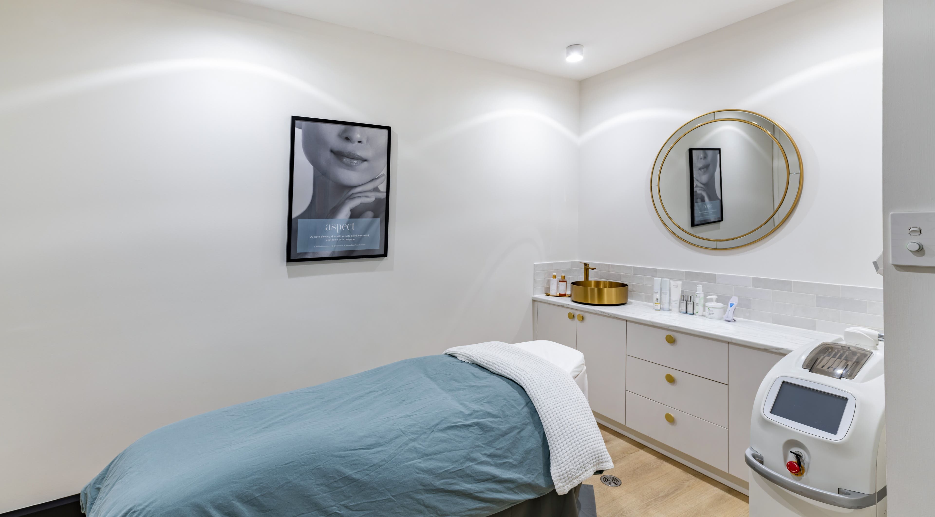 Elegant spa room at Belle Beauty + Co, Mount Pleasant, Western Australia, with a treatment bed and gold accents.