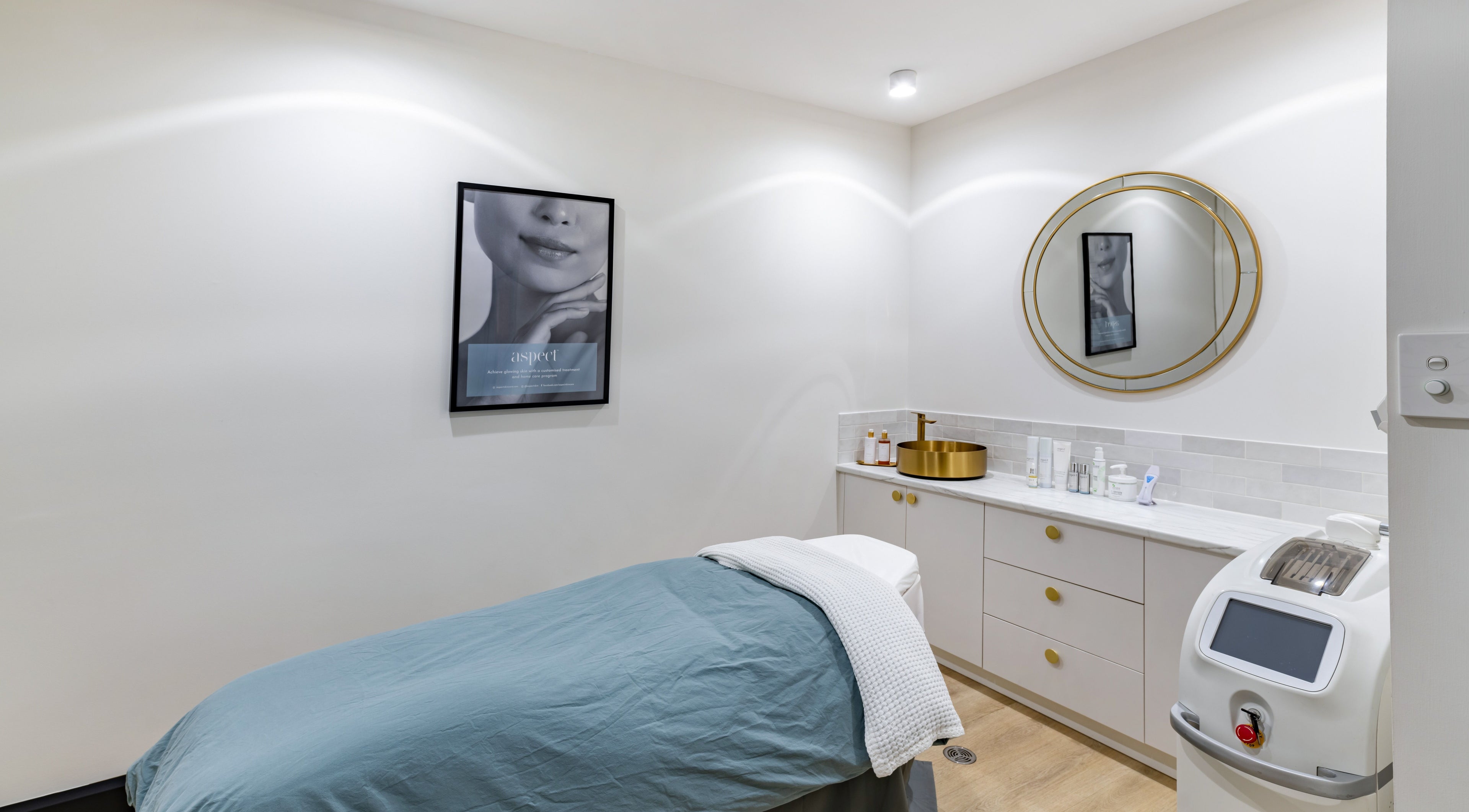 Elegant spa room at Belle Beauty + Co, Mount Pleasant, Western Australia, with a treatment bed and gold accents.