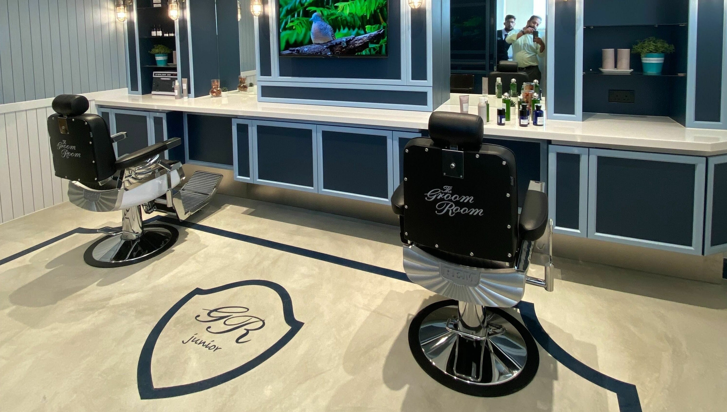 The Groom Room - Riffa Views in Al Mazrowiah, BH, offers sophisticated grooming chairs in a sleek setting.