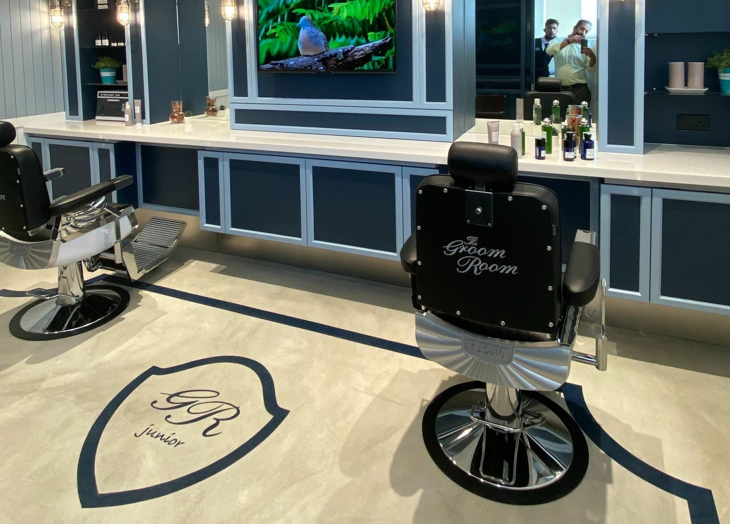 The Groom Room - Riffa Views in Al Mazrowiah, BH, offers sophisticated grooming chairs in a sleek setting.