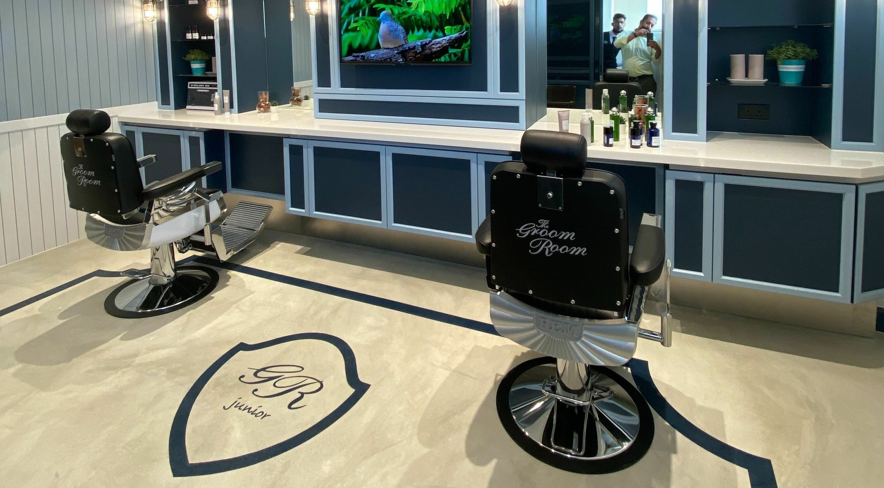 The Groom Room - Riffa Views in Al Mazrowiah, BH, offers sophisticated grooming chairs in a sleek setting.