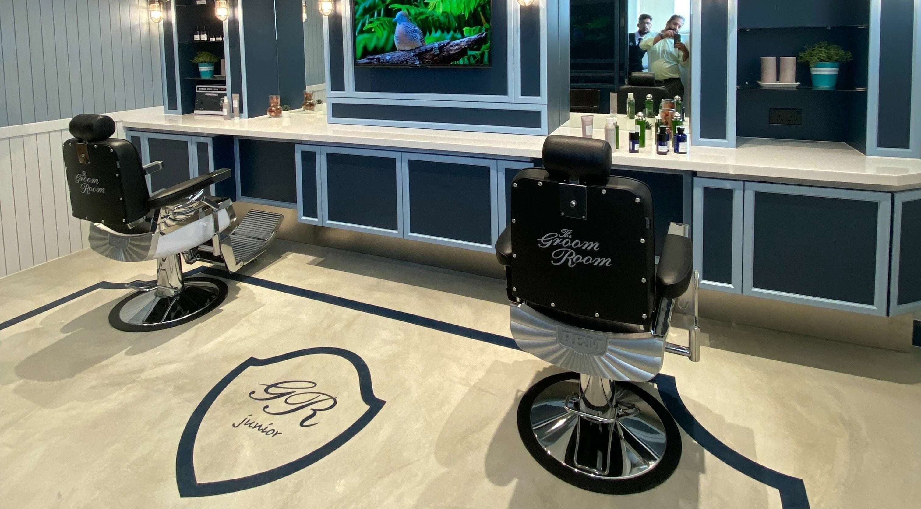 The Groom Room - Riffa Views in Al Mazrowiah, BH, offers sophisticated grooming chairs in a sleek setting.