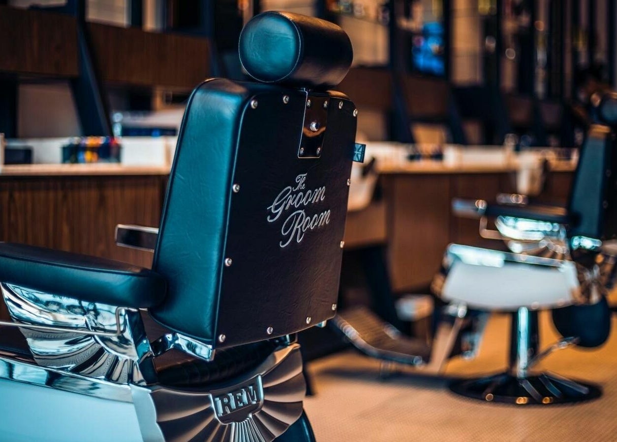 Elegant barber chairs at The Groom Room - Riffa Views, Al Mazrowiah, BH offering premium grooming services.