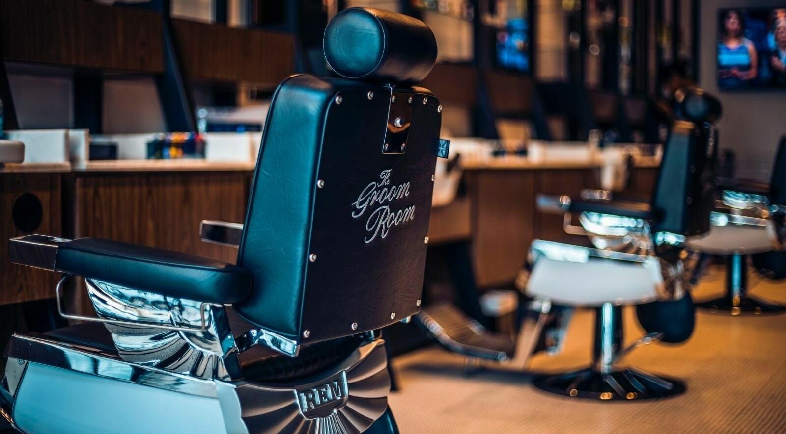 Elegant barber chairs at The Groom Room - Riffa Views, Al Mazrowiah, BH offering premium grooming services.