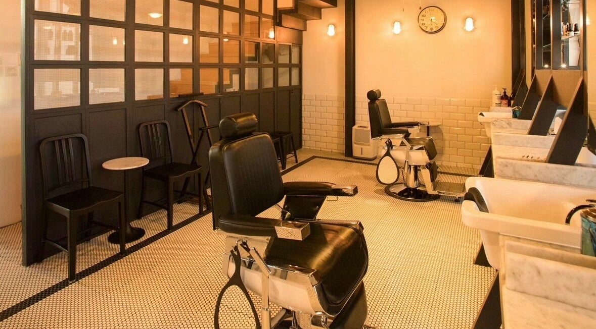 Stylish barber chairs at The Groom Room | Janabiya, Al Janabiya, BH with modern interior.