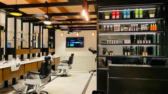 The Groom Room | Dilmunia, a stylish barber setting on Dilmunia Island, BH, features sleek chairs and product displays.