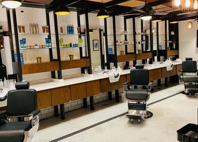 Modern barber chairs in The Groom Room | Dilmunia on Dilmunia Island, BH reflecting elegance and style.
