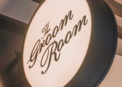 The Groom Room | Dilmunia sign at Dilmunia Island, BH, elegantly illuminated against a modern backdrop.