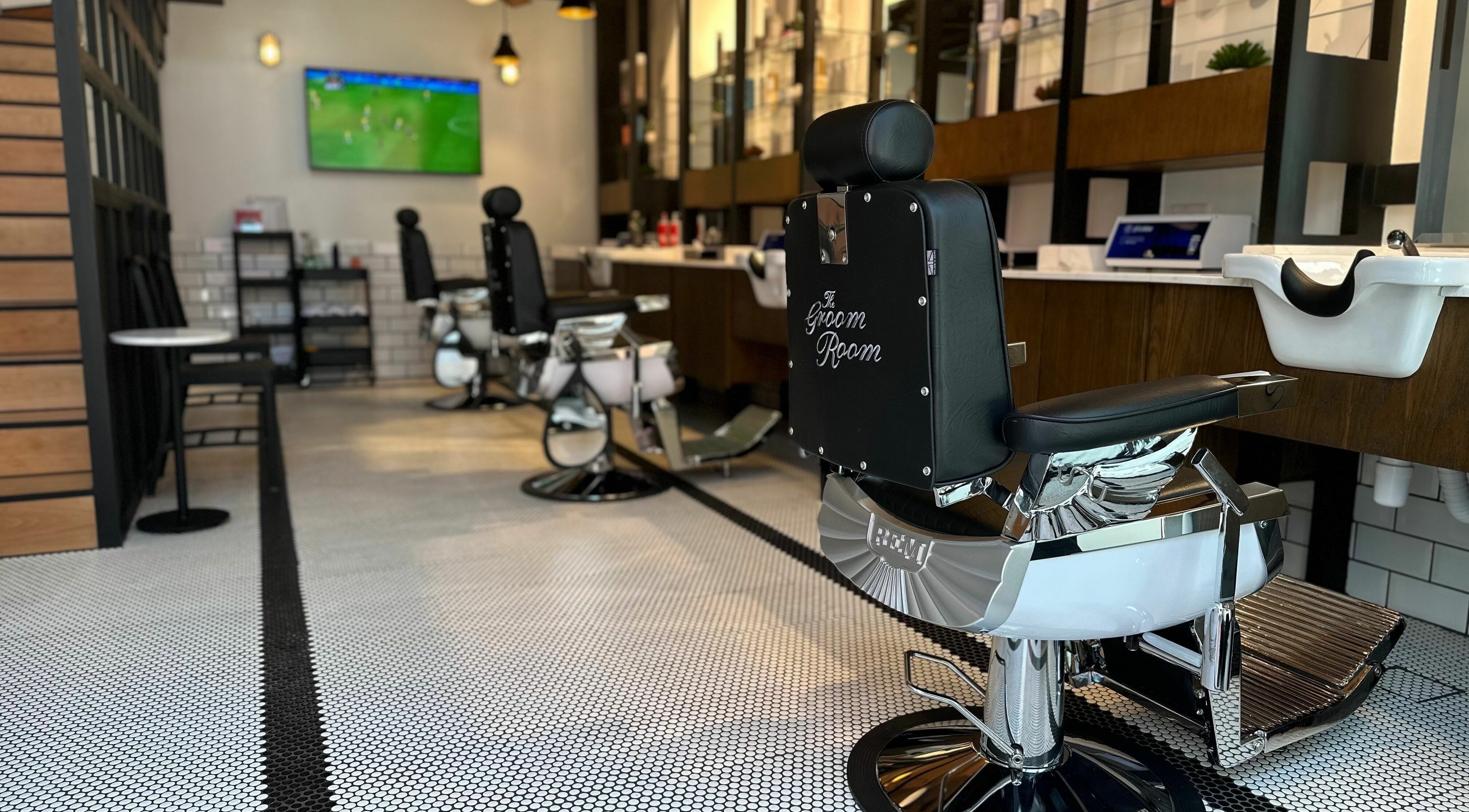 Elegant interior of The Groom Room - Riffa Courtyard in Riffa Alshamali, BH with sleek barber chairs.