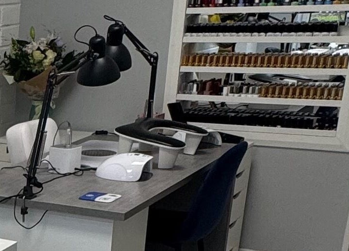 Nail station at LS Nails and Training, Carrigtowhill, County Cork, IE, featuring organized nail polishes.