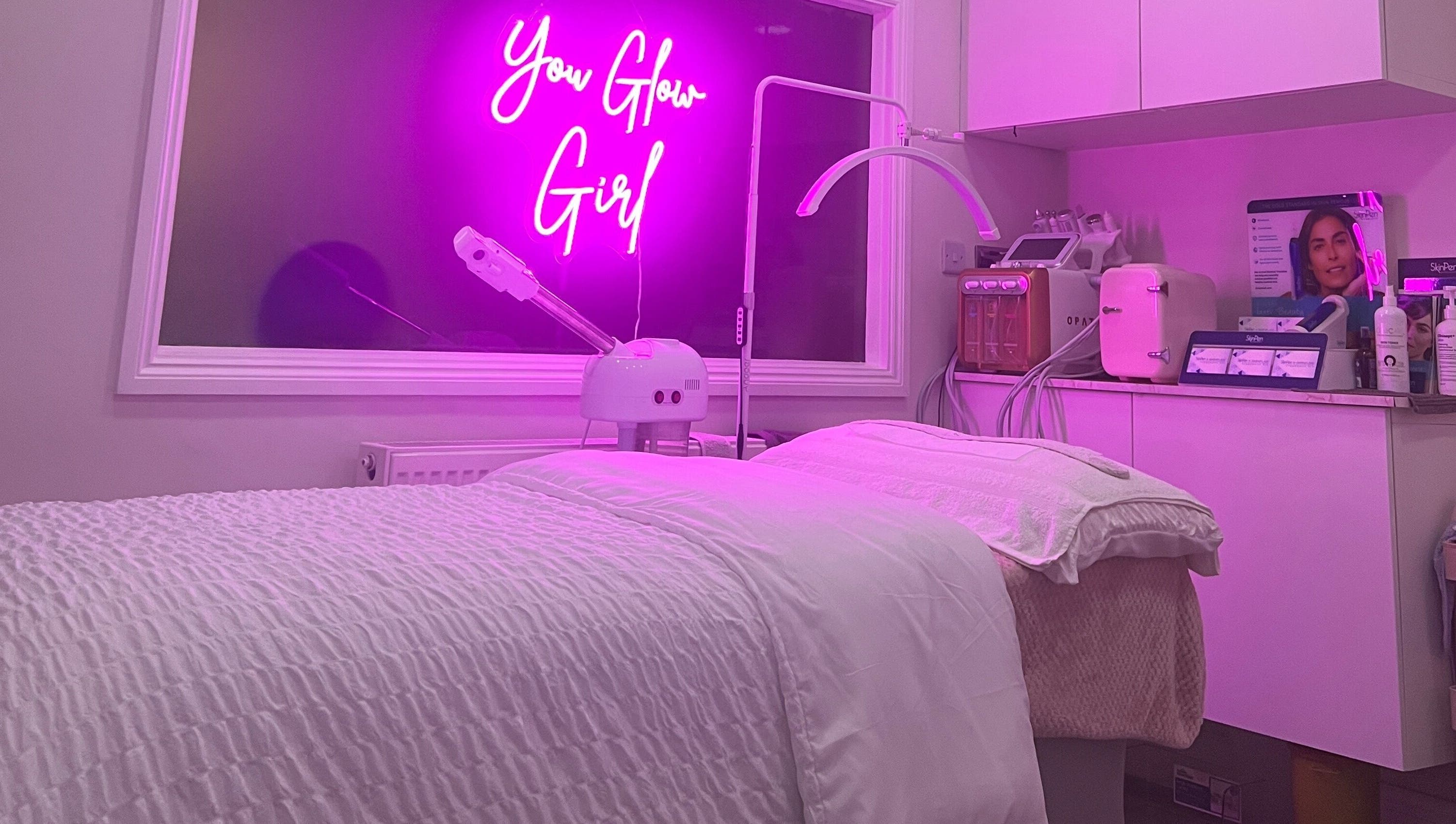 Modern treatment room at The Facial Bar, North London, England, GB with ambient purple lighting.