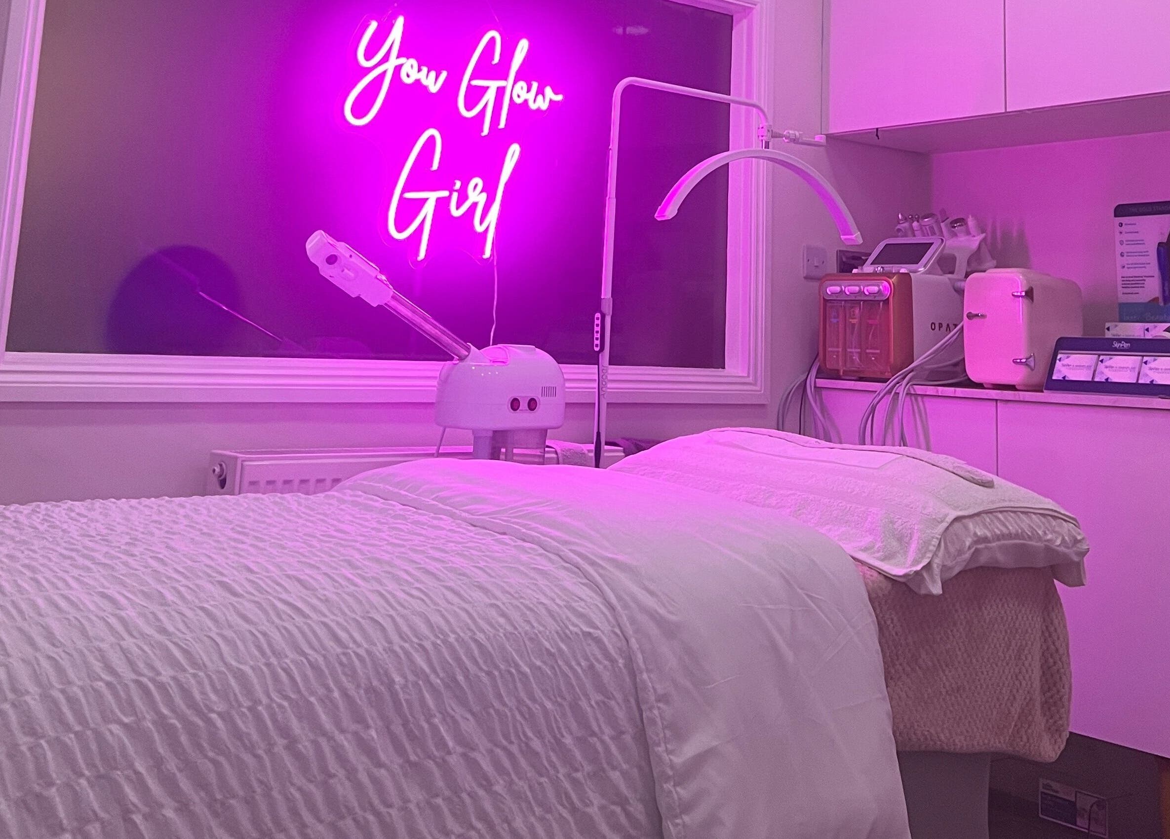 Modern treatment room at The Facial Bar, North London, England, GB with ambient purple lighting.