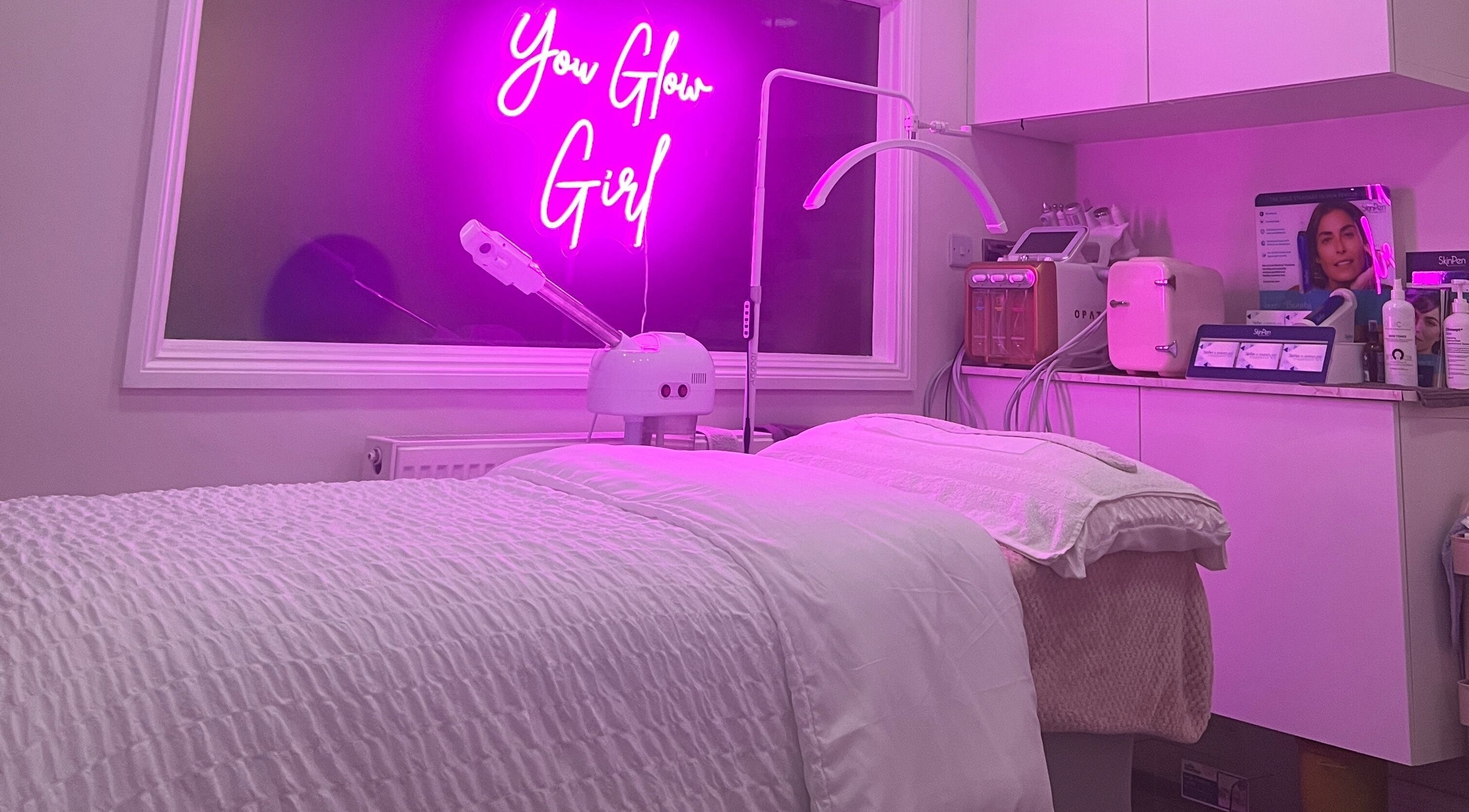Modern treatment room at The Facial Bar, North London, England, GB with ambient purple lighting.