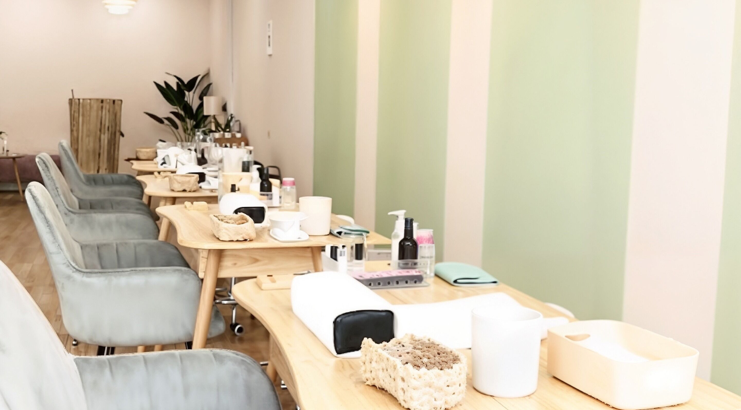 Elegant interior of Manikyu salon with cozy chairs and manicure stations, located in CHERAS, KUALA LUMPUR, MY.