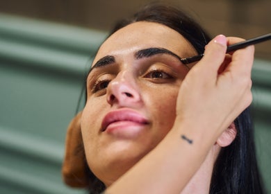 A skilled artist shapes eyebrows at Fina, B kara, MT, enhancing beauty and confidence.