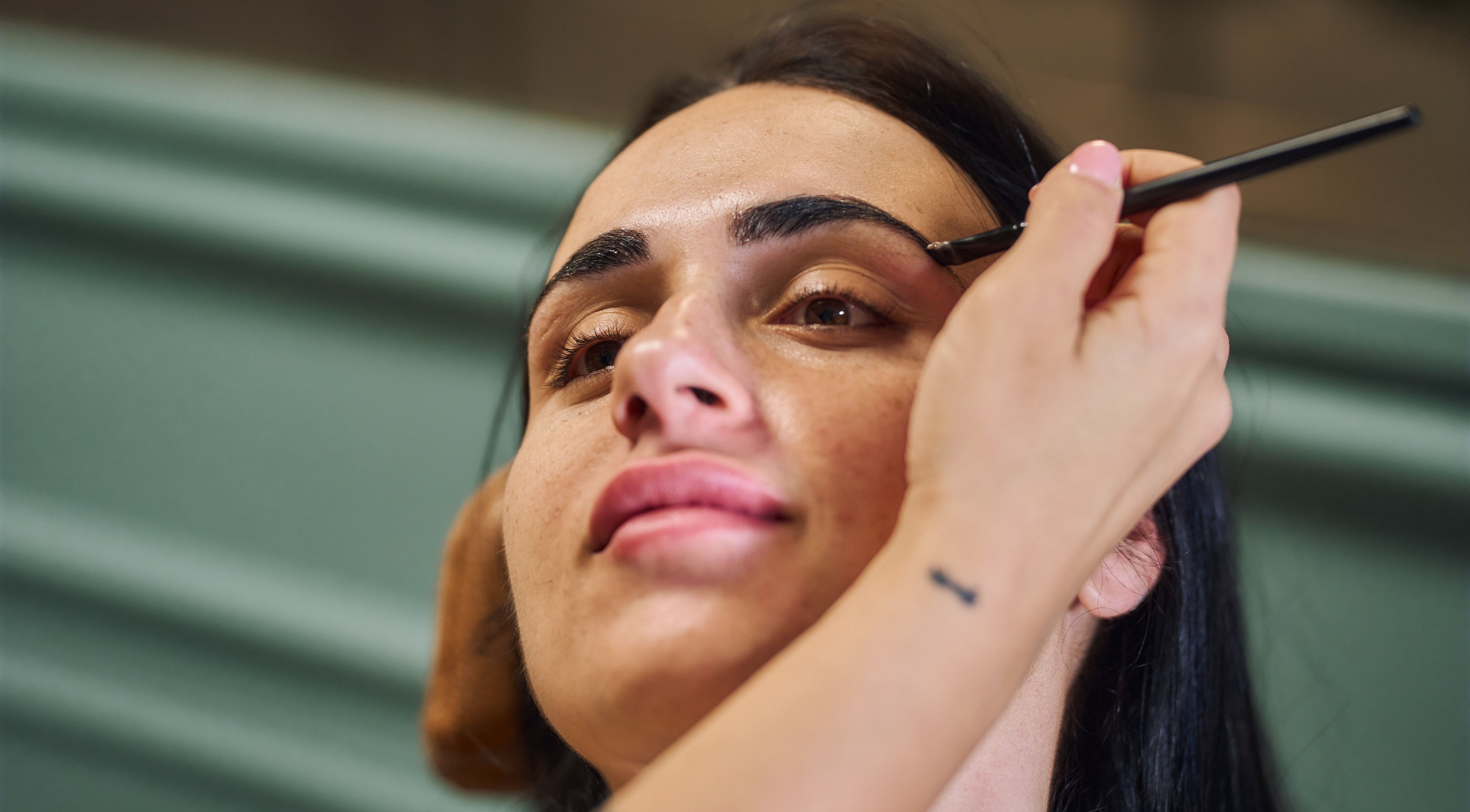 Eyebrow shaping service at Fina in B kara, MT offering expert beauty treatments.