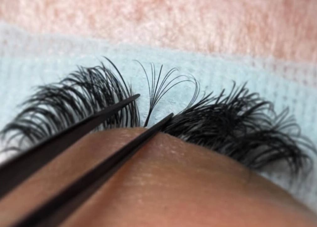 Close-up of eyelash extension application at Megan Ellen Beauty, Rushmere Saint Andrew, England, GB.