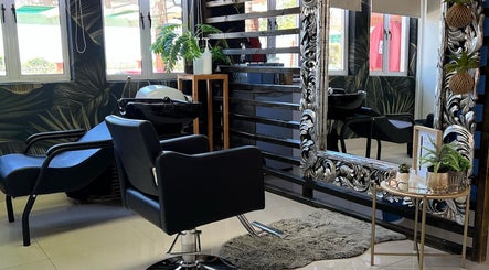 Stylish salon interior at Durban Designer Brows SA, Umhlanga, Kwazulu-natal, ZA with ornate mirror and plants.