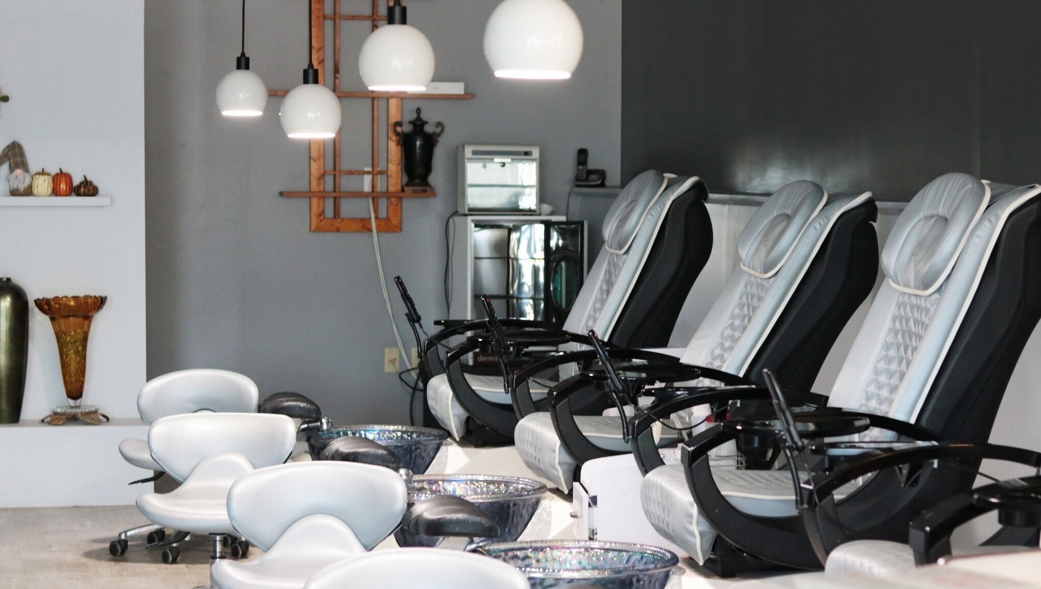 Elysian Nails' sleek pedicure chairs in Neenah, Wisconsin offer a serene spa experience.
