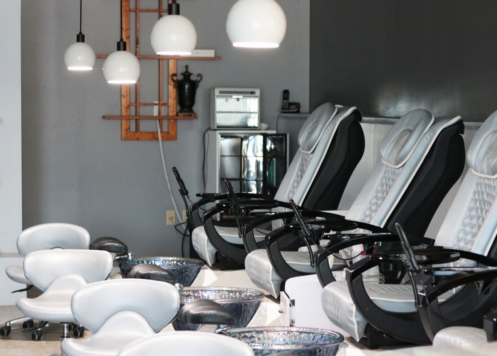Elysian Nails' sleek pedicure chairs in Neenah, Wisconsin offer a serene spa experience.