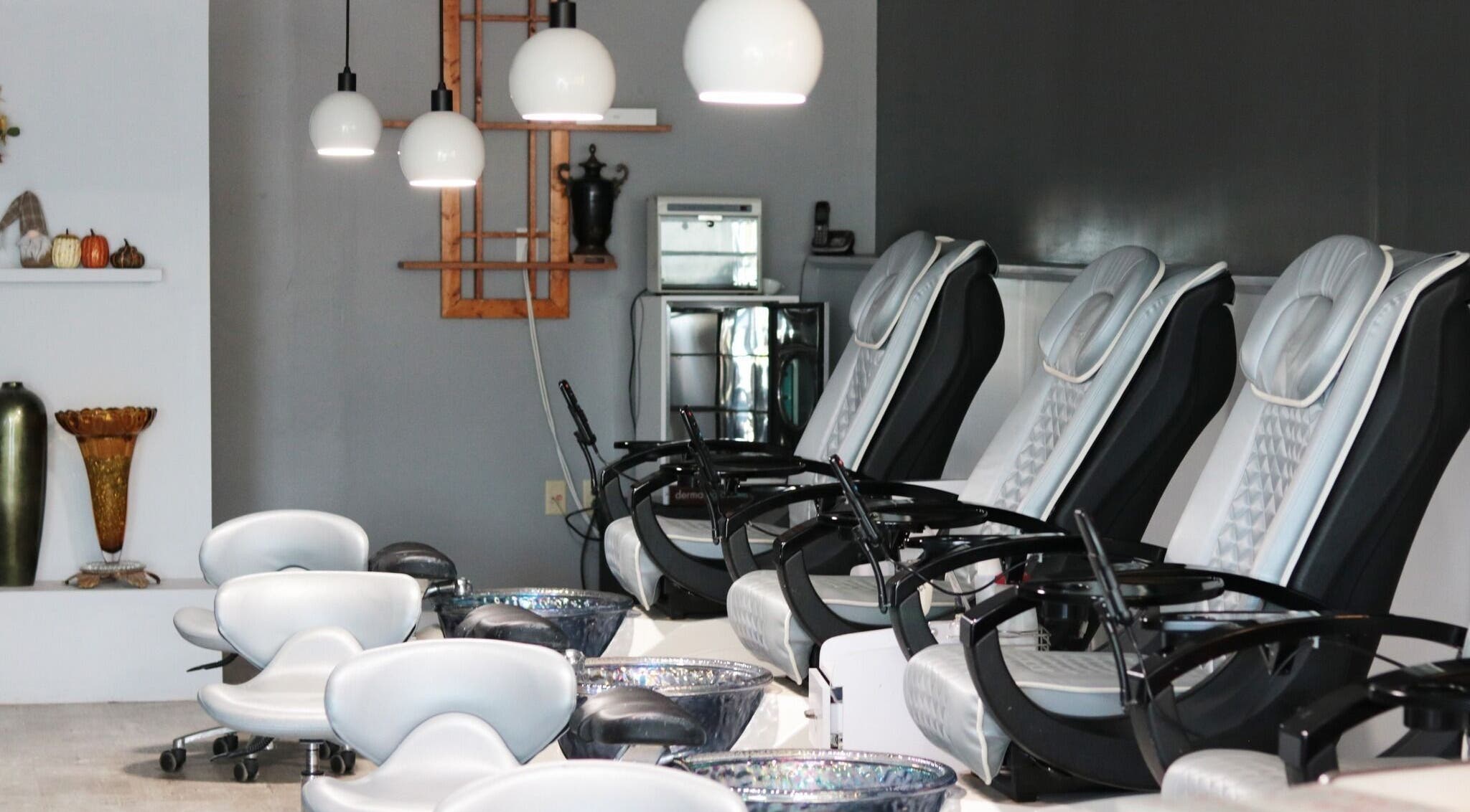 Elysian Nails' sleek pedicure chairs in Neenah, Wisconsin offer a serene spa experience.