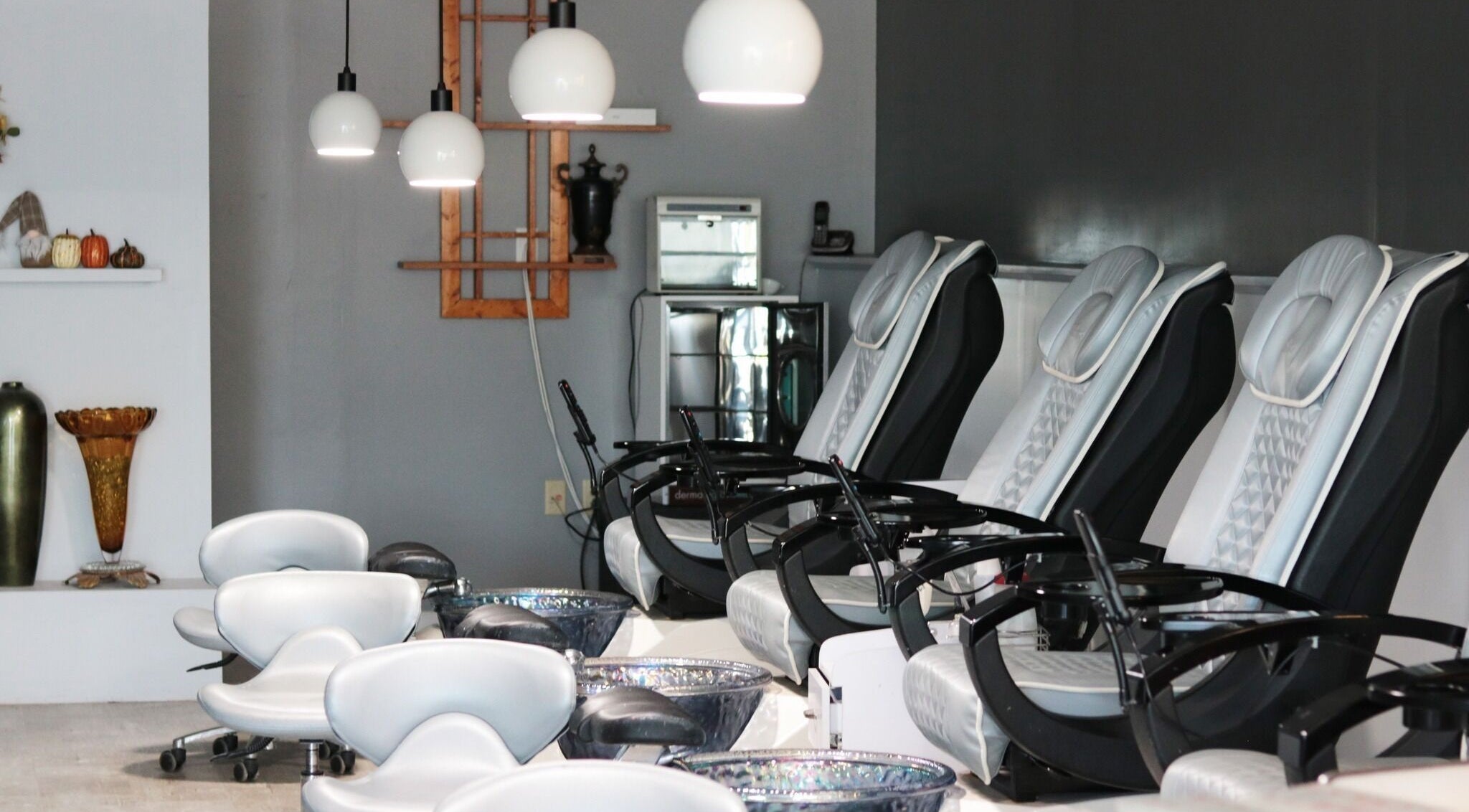 Elysian Nails' sleek pedicure chairs in Neenah, Wisconsin offer a serene spa experience.
