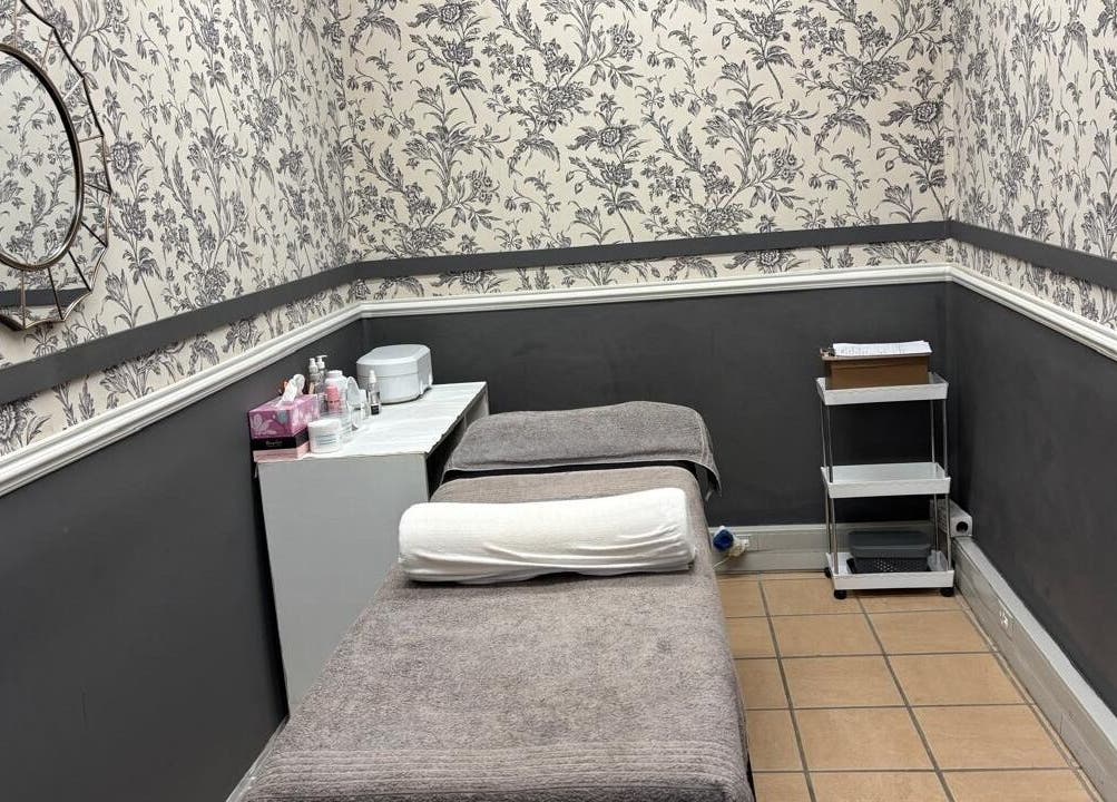 Cozy treatment room at Made up by Mariam, Hillcrest, Kwazulu-natal, ZA with elegant floral wallpaper.