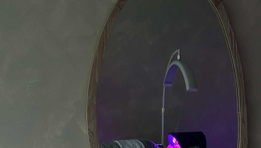 EVSSKIN's elegant and modern treatment room in San Fernando, California, US, with ambient lighting and plush decor.