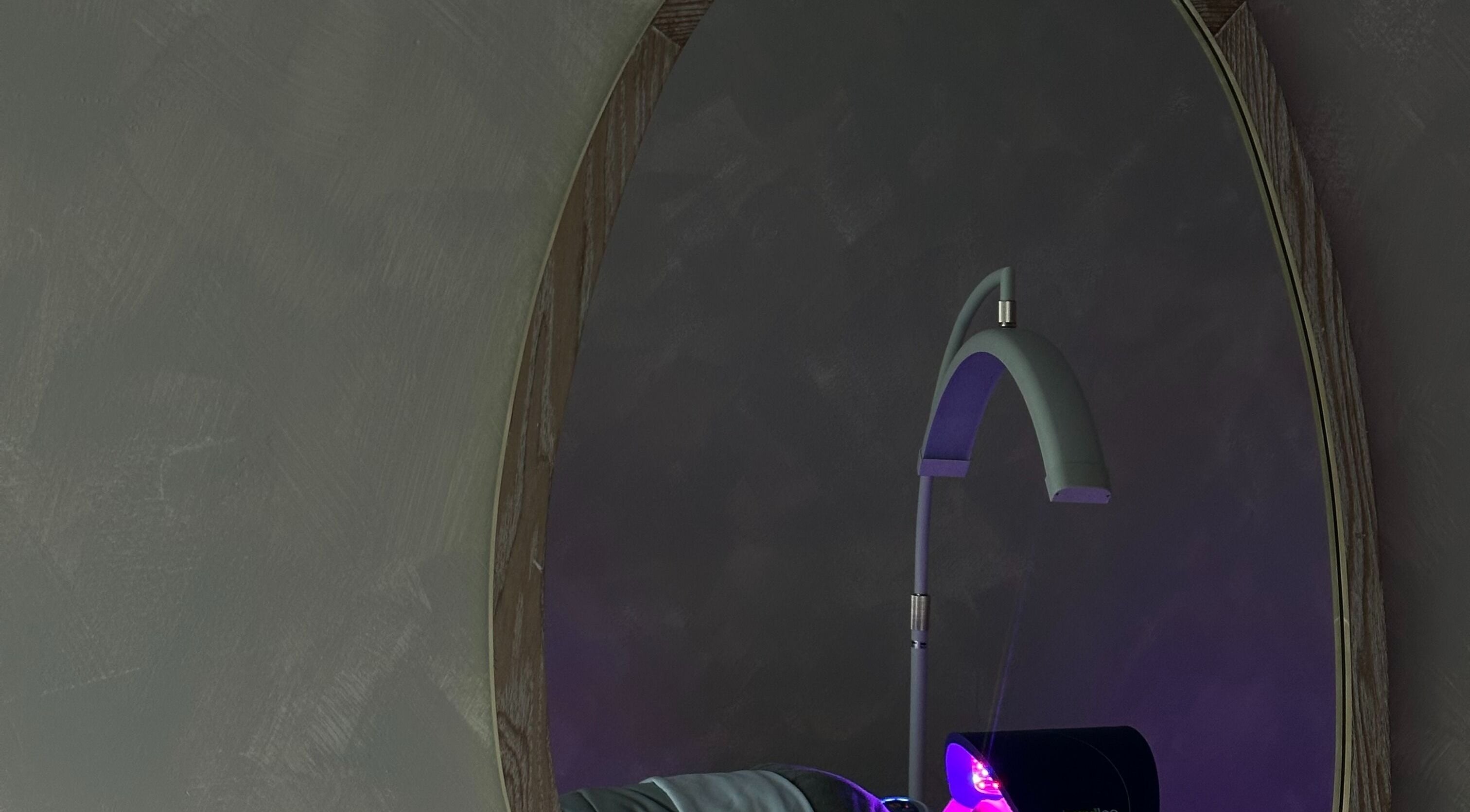 EVSSKIN's elegant and modern treatment room in San Fernando, California, US, with ambient lighting and plush decor.