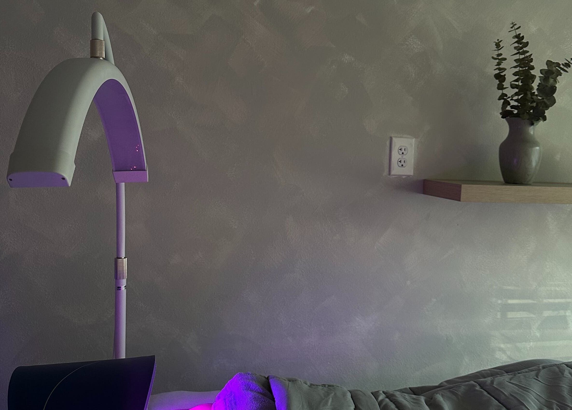 Relaxing spa setting at EVSSKIN in San Fernando, California with massage bed and ambient lighting.