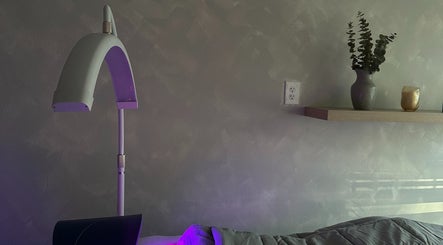 Relaxing spa setting at EVSSKIN in San Fernando, California with massage bed and ambient lighting.