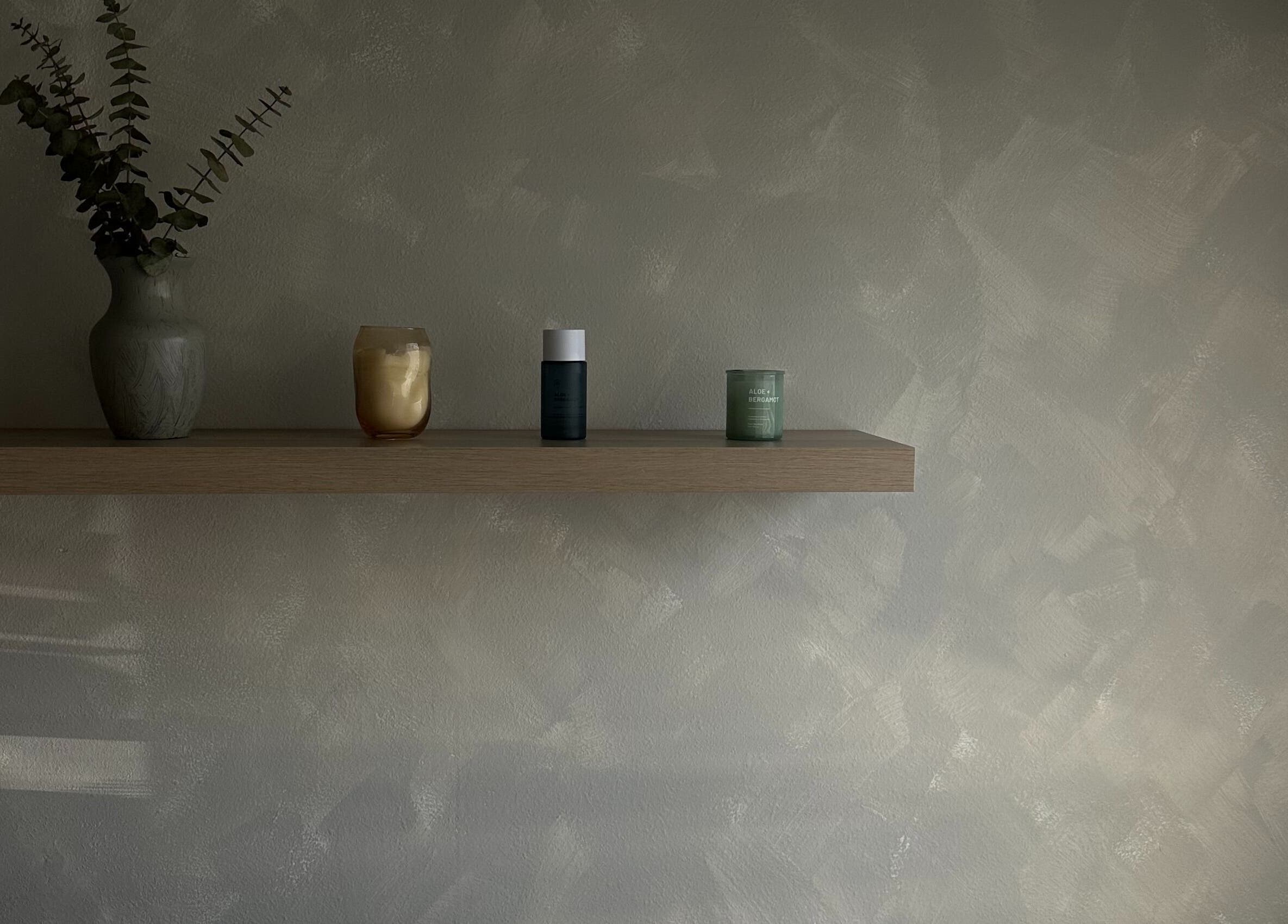 Elegant shelf with plants and candles at EVSSKIN, San Fernando, California, US.