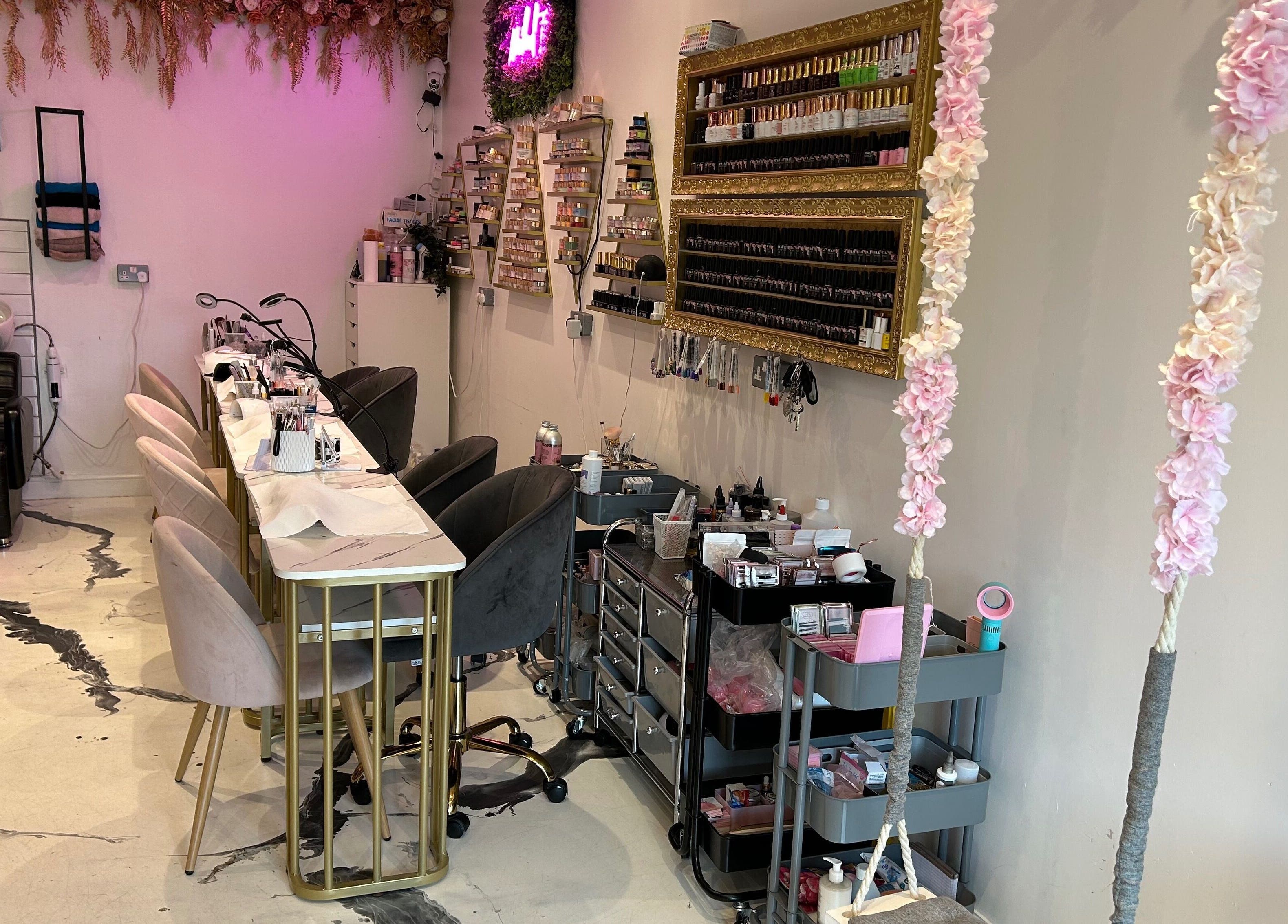 Elegant nail setup at The SAS Sanctuary and Academy, Stockport, England, GB, with stylish decor and seating.