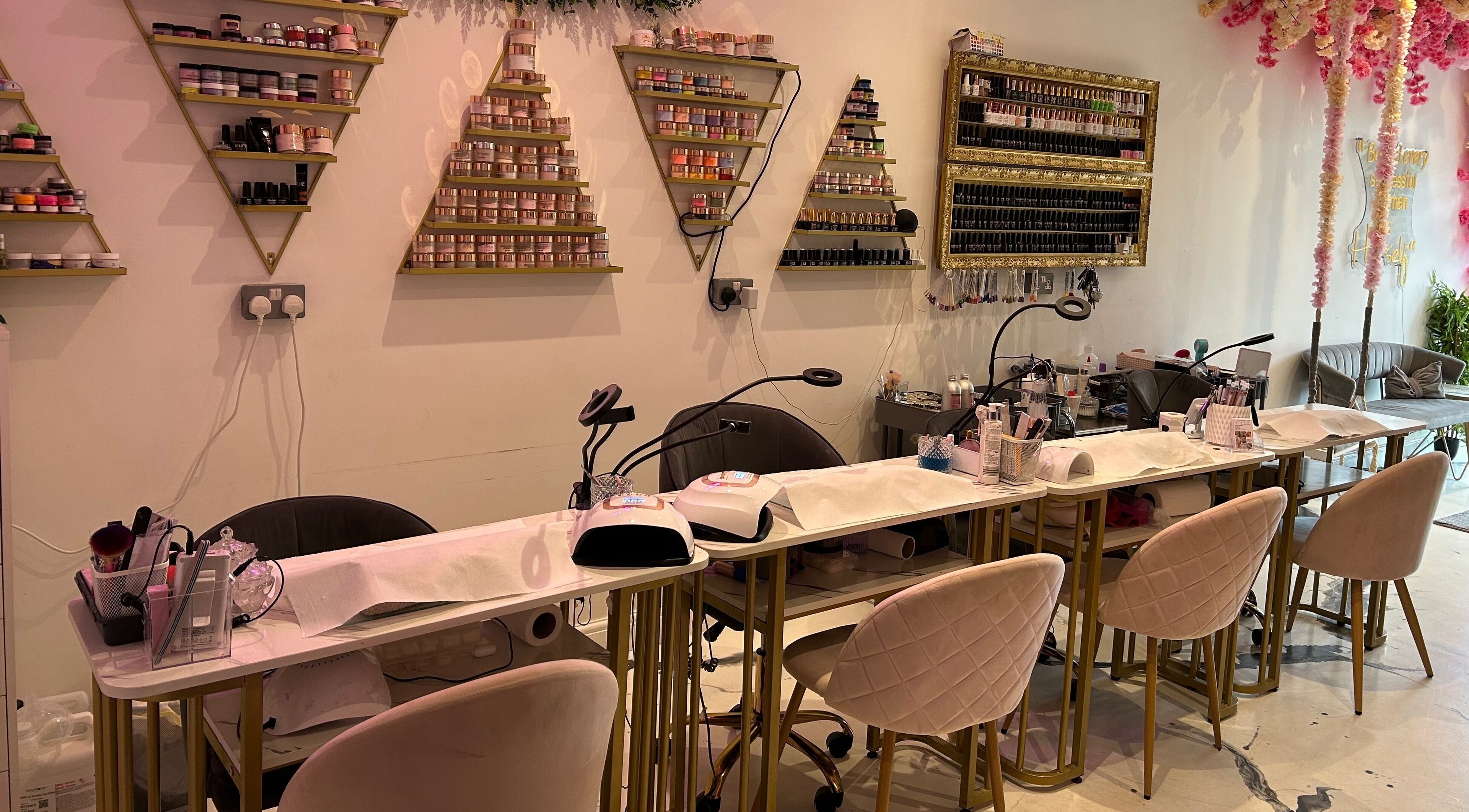 Nail service area at The SAS Sanctuary and Academy, Stockport, England with decor and manicure stations.